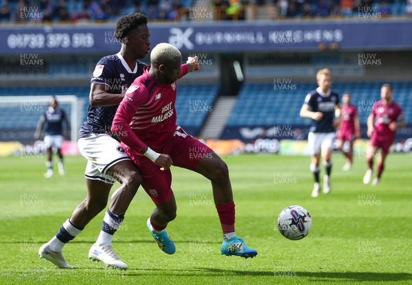 130424 - Millwall v Cardiff City - Sky Bet Championship - Jamilu Collins of Cardiff City is challenged by Romain Esse of Millwall