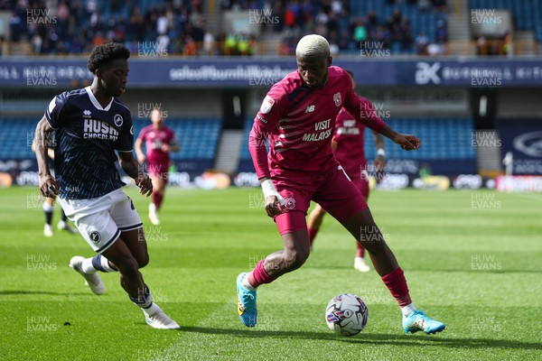 130424 - Millwall v Cardiff City - Sky Bet Championship - Jamilu Collins of Cardiff City is pressured by Romain Esse of Millwall