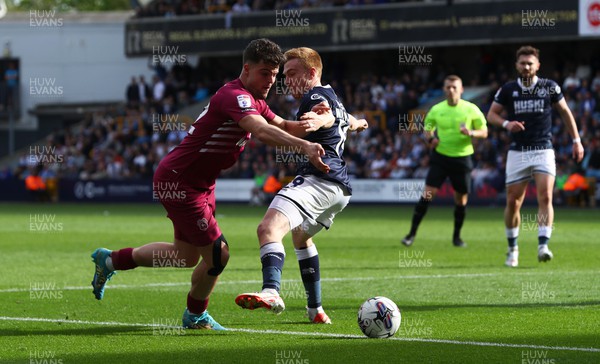 130424 - Millwall v Cardiff City - Sky Bet Championship - Ollie Tanner of Cardiff City runs at Duncan Watmore of Millwall