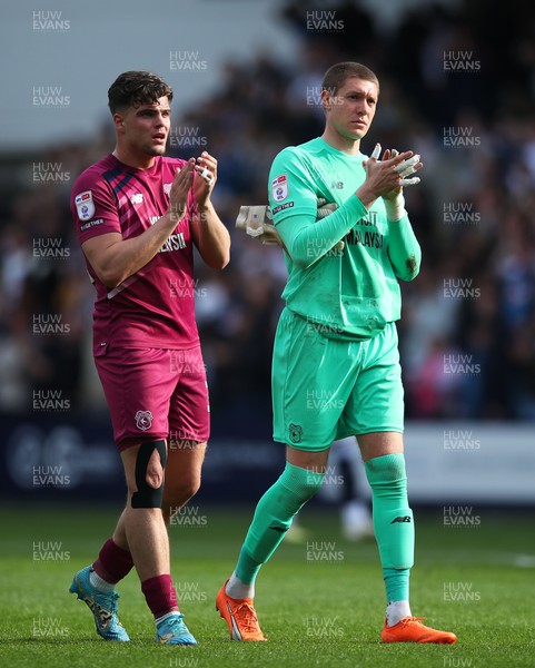 130424 - Millwall v Cardiff City - Sky Bet Championship - Ollie Tanner and Ethan Horvath of Cardiff City applaud fans after the full-time whistle