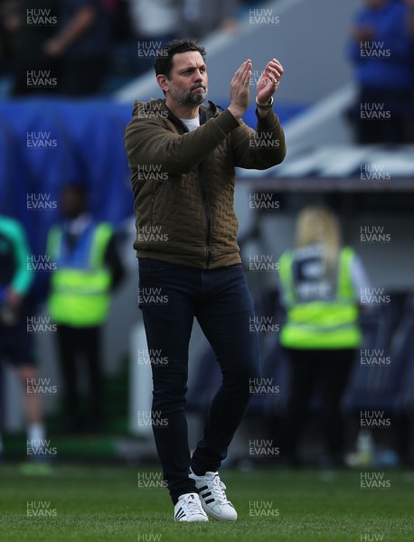 130424 - Millwall v Cardiff City - Sky Bet Championship - Erol Bulut, Manager of Cardiff City applauds fans after the full-time whistle