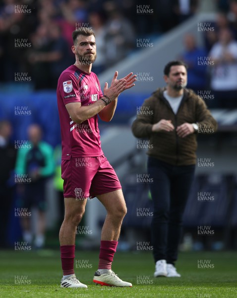 130424 - Millwall v Cardiff City - Sky Bet Championship - Dimitris Goutas of Cardiff City applauds fans after the full-time whistle