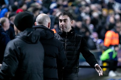 210125 - Millwall v Cardiff City - Sky Bet Championship - Ömer Riza manager of Cardiff City greets Alex Neil manager of Millwall