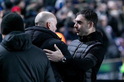 210125 - Millwall v Cardiff City - Sky Bet Championship - Ömer Riza manager of Cardiff City greets Alex Neil manager of Millwall