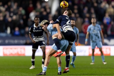 210125 - Millwall v Cardiff City - Sky Bet Championship - Rubin Colwill of Cardiff City and George Saville of Millwall battle for the ball