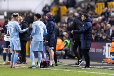 210125 - Millwall v Cardiff City - Sky Bet Championship - Ömer Riza manager of Cardiff City  talks to the players