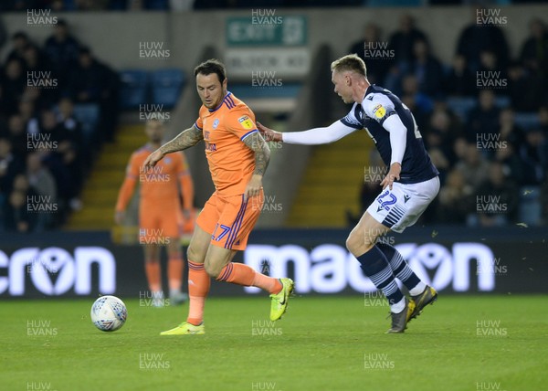 221019 - Millwall v Cardiff City - Sky Bet Championship -  Cardiff's Lee Tomlin is watched by Danny O'Brien of Millwall