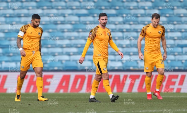 040120 - Millwall v Newport County - FA Cup Round 3 - Dejected Joss Labadie, Padraig Amond and Mickey Demetriou of Newport County