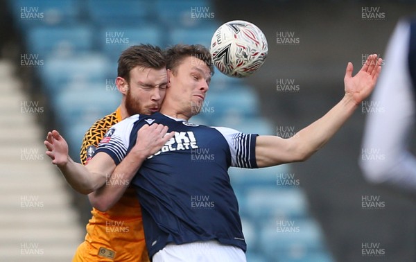 040120 - Millwall v Newport County - FA Cup Round 3 - Mark O'Brien of Newport County challenges Matt Smith of Millwall