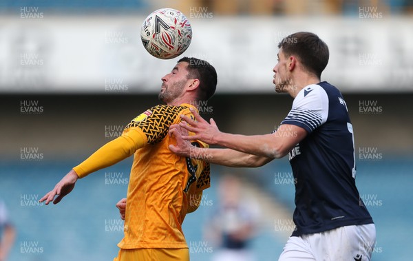 040120 - Millwall v Newport County - FA Cup Round 3 - Padraig Amond of Newport County is challenged by Jayson Molumby of Millwall