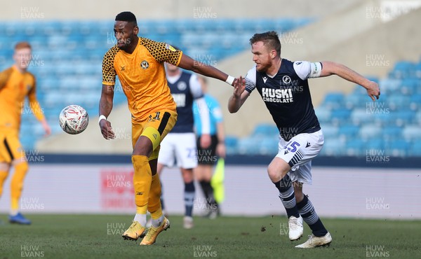 040120 - Millwall v Newport County - FA Cup Round 3 - Jamille Matt of Newport County is challenged by Alex Pearce of Millwall