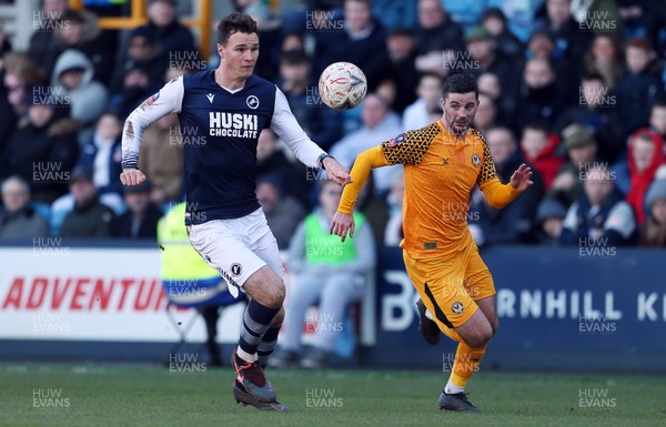 040120 - Millwall v Newport County - FA Cup Round 3 - Jake Cooper of Millwall is challenged by Padraig Amond of Newport County