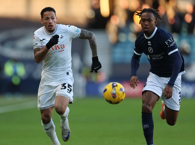 040126 - Millwall v Swansea City, EFL Sky Bet Championship - Ronald of Swansea City and Zak Sturge of Millwall compete for the ball