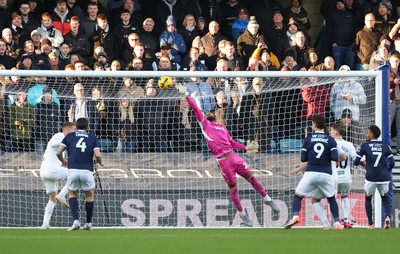 040126 - Millwall v Swansea City, EFL Sky Bet Championship - Swansea City goalkeeper Lawrence Vigouroux tips the ball over the bar