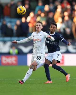 040126 - Millwall v Swansea City, EFL Sky Bet Championship - Ethan Galbraith of Swansea City and Thierno Ballo of Millwall  compete for the ball