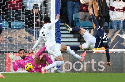 040126 - Millwall v Swansea City, EFL Sky Bet Championship - Swansea City goalkeeper Lawrence Vigouroux saves from Macaulay Langstaff of Millwall