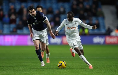 040126 - Millwall v Swansea City, EFL Sky Bet Championship - Malick Yalcouye of Swansea City gets away from Tristan Crama of Millwall