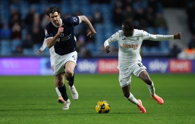 040126 - Millwall v Swansea City, EFL Sky Bet Championship - Malick Yalcouye of Swansea City gets away from Tristan Crama of Millwall