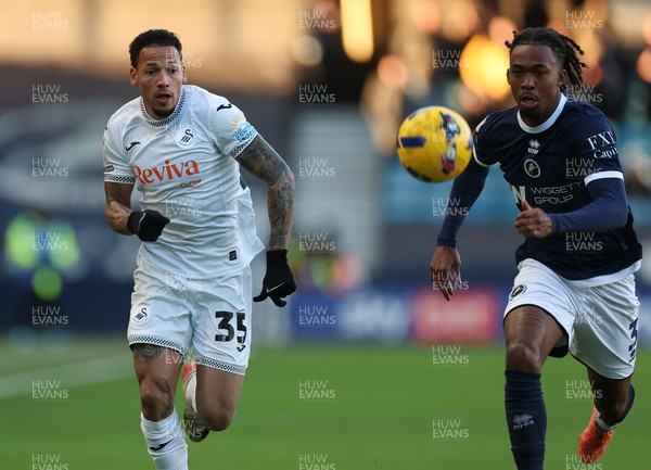 040126 - Millwall v Swansea City, EFL Sky Bet Championship - Ronald of Swansea City and Zak Sturge of Millwall compete for the ball