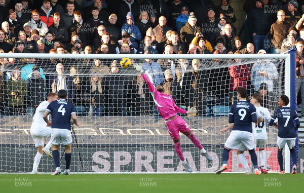 040126 - Millwall v Swansea City, EFL Sky Bet Championship - Swansea City goalkeeper Lawrence Vigouroux tips the ball over the bar