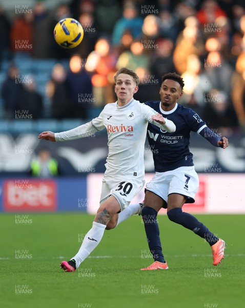 040126 - Millwall v Swansea City, EFL Sky Bet Championship - Ethan Galbraith of Swansea City and Thierno Ballo of Millwall  compete for the ball