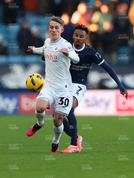 040126 - Millwall v Swansea City, EFL Sky Bet Championship - Ethan Galbraith of Swansea City and Thierno Ballo of Millwall  compete for the ball