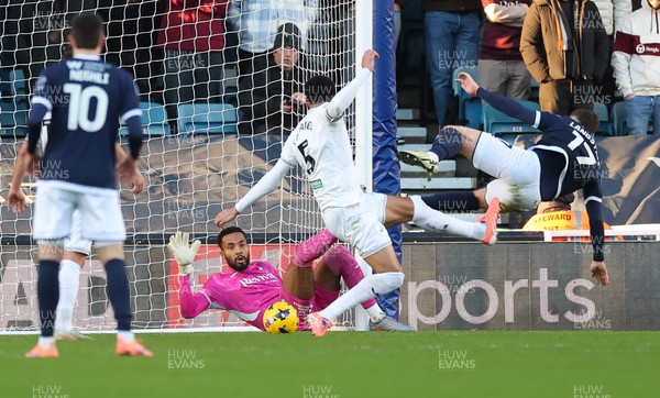 040126 - Millwall v Swansea City, EFL Sky Bet Championship - Swansea City goalkeeper Lawrence Vigouroux saves from Macaulay Langstaff of Millwall