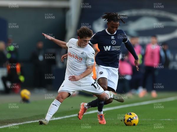 040126 - Millwall v Swansea City, EFL Sky Bet Championship - Goncalo Franco of Swansea City and Zak Sturge of Millwall  compete for the ball