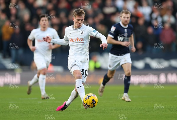 040126 - Millwall v Swansea City, EFL Sky Bet Championship - Ethan Galbraith of Swansea City plays the ball forward