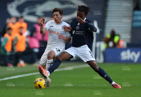 040126 - Millwall v Swansea City, EFL Sky Bet Championship - Goncalo Franco of Swansea City and Zak Sturge of Millwall  compete for the ball