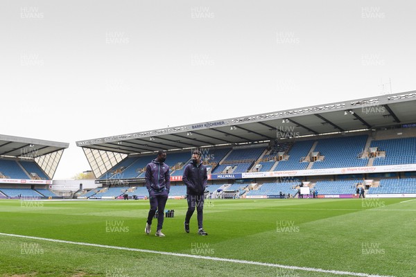 100421 - Millwall v Swansea City - Sky Bet Championship - Marc Guehi of Swansea City and Joel Latibeaudiere on the pitch before the game