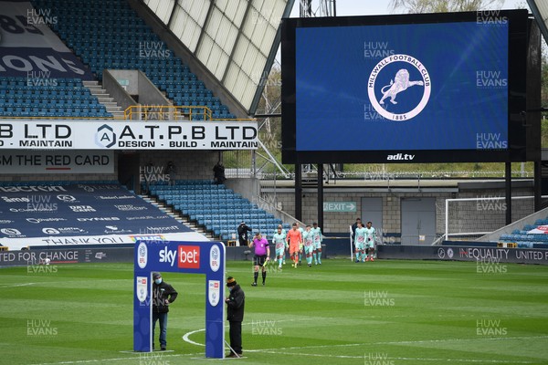 100421 - Millwall v Swansea City - Sky Bet Championship - Swansea players come out on to the pitch from the temporary changing rooms
