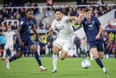 131026 - Millwall v Swansea City - Sky Bet Championship -  Marko Stamenic of Swansea City and Jenson Metcalfe of Millwall in action