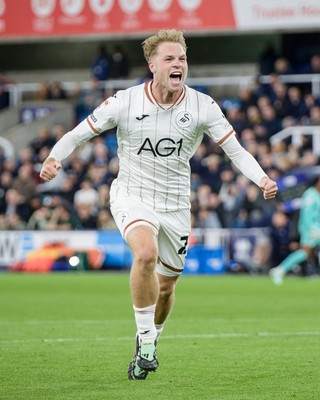 131026 - Millwall v Swansea City - Sky Bet Championship -  Stephen Welsh of Swansea City celebrates Ronald Pereira Martin of Swansea City goal
