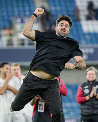 131026 - Millwall v Swansea City - Sky Bet Championship -  Vitor Matos manager of Swansea City celebrates with fans