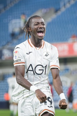 131026 - Millwall v Swansea City - Sky Bet Championship -   Moussa Kounfolo Yeo of Swansea City celebrates with fans