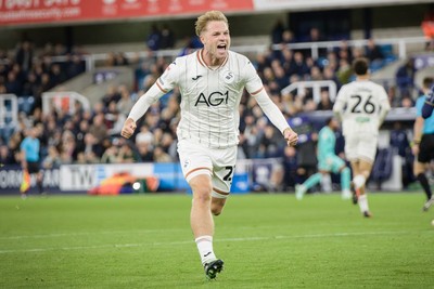 131026 - Millwall v Swansea City - Sky Bet Championship -  Stephen Welsh of Swansea City celebrates Ronald Pereira Martin of Swansea City goal