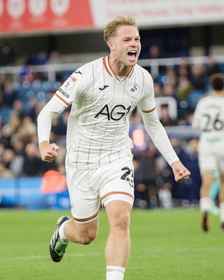 131026 - Millwall v Swansea City - Sky Bet Championship -  Stephen Welsh of Swansea City celebrates Ronald Pereira Martin of Swansea City goal
