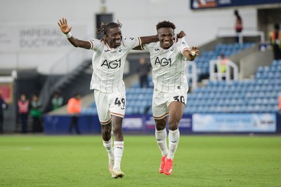 131026 - Millwall v Swansea City - Sky Bet Championship -  Moussa Kounfolo Yeo of Swansea City and Joseph Opoku of Swansea City celebrate with fans