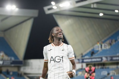 131026 - Millwall v Swansea City - Sky Bet Championship -  Moussa Kounfolo Yeo of Swansea City celebrates with fans