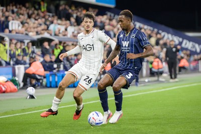 131026 - Millwall v Swansea City - Sky Bet Championship -  Filip Lissah of Swansea City and Zak Sturge of Millwall in action