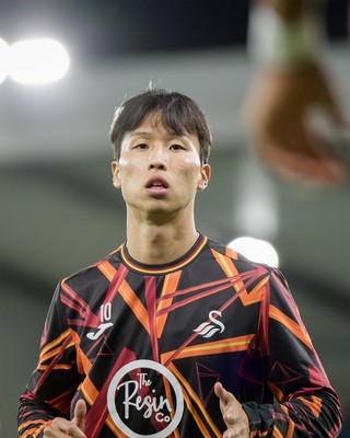 131026 - Millwall v Swansea City - Sky Bet Championship - Jisung Eom of Swansea City warming up