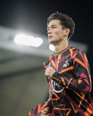 131026 - Millwall v Swansea City - Sky Bet Championship -  Elijah Just of Swansea City warming up