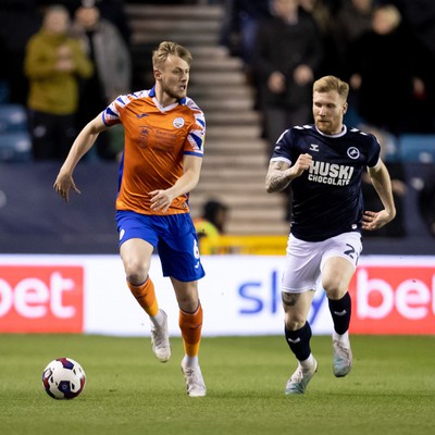 140323 - Millwall v Swansea City - Sky Bet Championship - Harry Darling of Swansea City and Andreas Voglsammer of Millwall battle for the ball