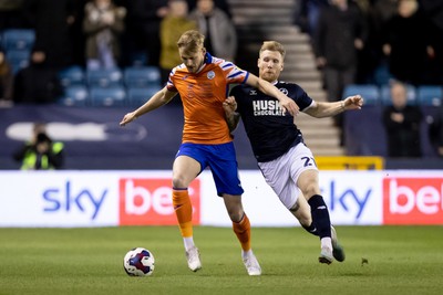 140323 - Millwall v Swansea City - Sky Bet Championship - Harry Darling of Swansea City and Andreas Voglsammer of Millwall battle for the ball