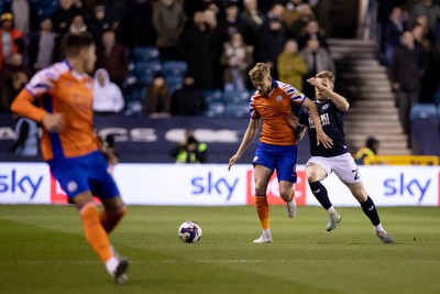 140323 - Millwall v Swansea City - Sky Bet Championship - Harry Darling of Swansea City and Andreas Voglsammer of Millwall battle for the ball