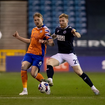 140323 - Millwall v Swansea City - Sky Bet Championship - Harry Darling of Swansea City and Andreas Voglsammer of Millwall battle for the ball