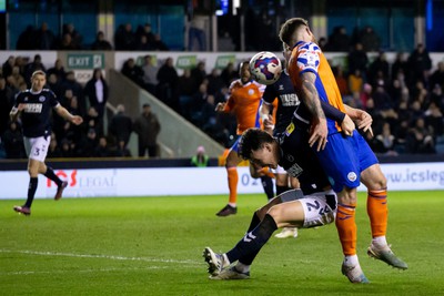 140323 - Millwall v Swansea City - Sky Bet Championship - Danny McNamara of Millwall and Ryan Manning of Swansea City battle for the ball