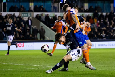 140323 - Millwall v Swansea City - Sky Bet Championship - Danny McNamara of Millwall and Ryan Manning of Swansea City battle for the ball