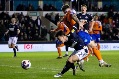 140323 - Millwall v Swansea City - Sky Bet Championship - Danny McNamara of Millwall and Ryan Manning of Swansea City battle for the ball